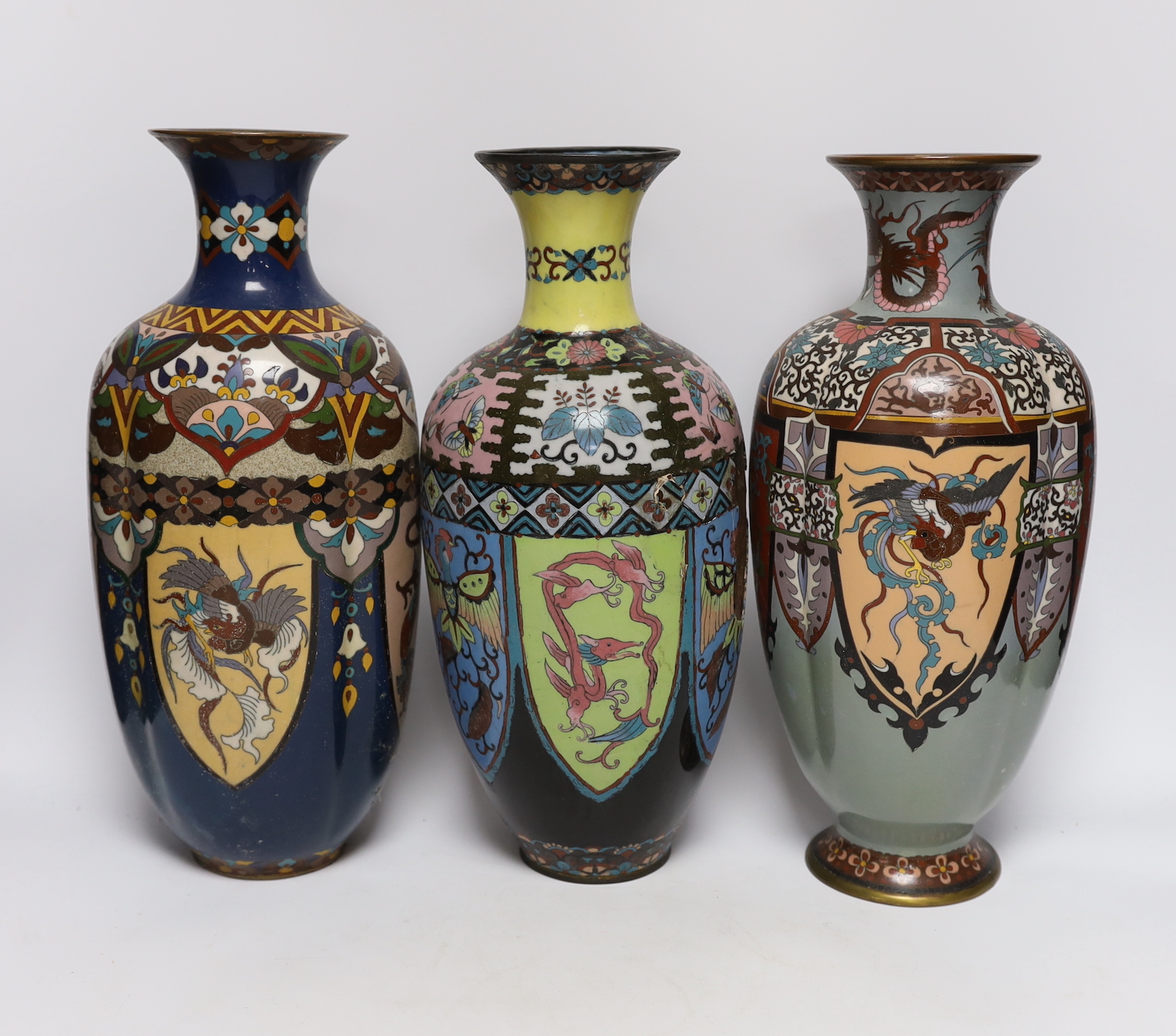 A pair of large Japanese cloisonné enamel vases, together with three similar vases, early 20th century, tallest 36.5cm high (5)